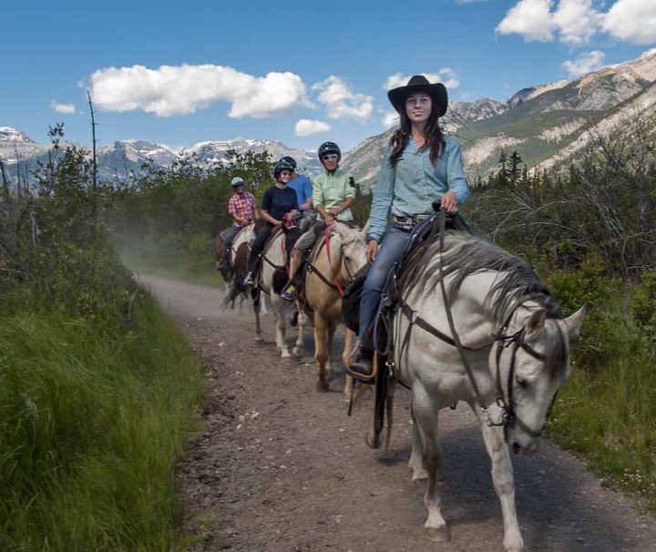 Follow your guide on a scenic Bow River horseback ride with Banff Trail Riders in the Canadian Rockies