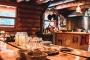 Dine at the large kitchen table at cozy Sundance Lodge