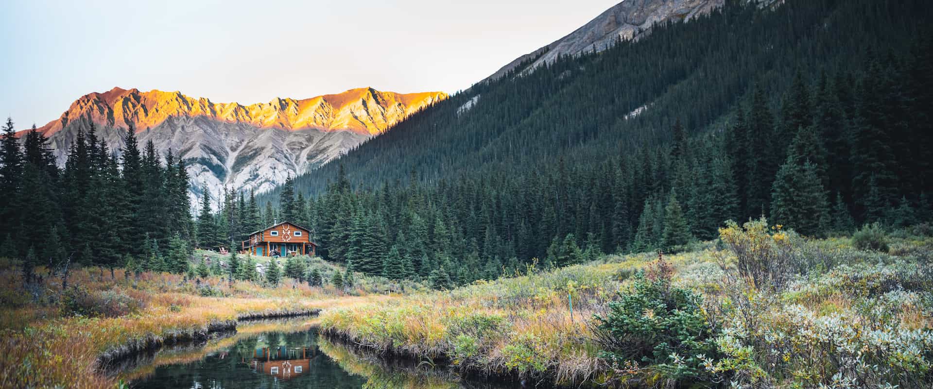 Stay in rustic comfort at log cabin Halfway Lodge on a backcountry vacation